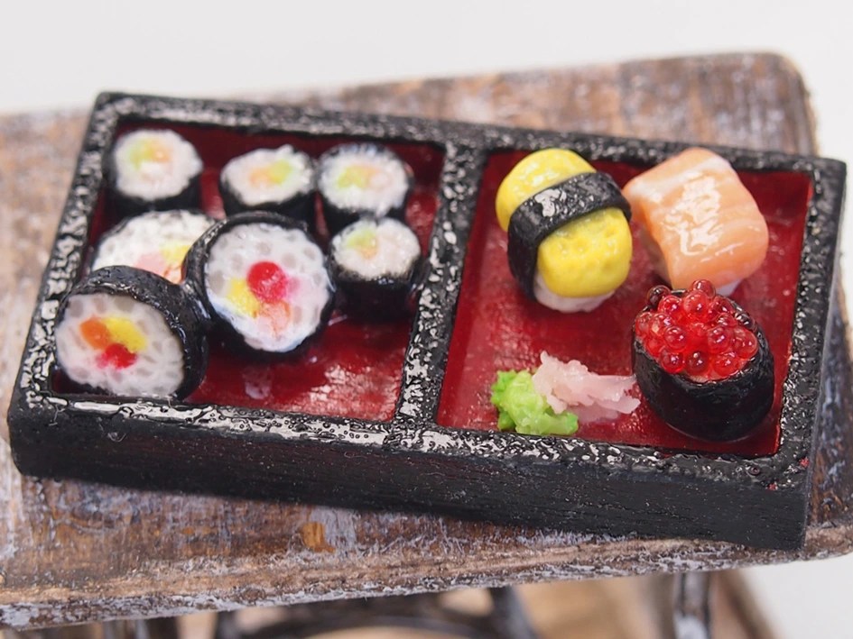 Miniature clay sushi maki rolls made during a Fun With Art team building workshop in Singapore, promoting creativity and collaboration through hands-on sculpting